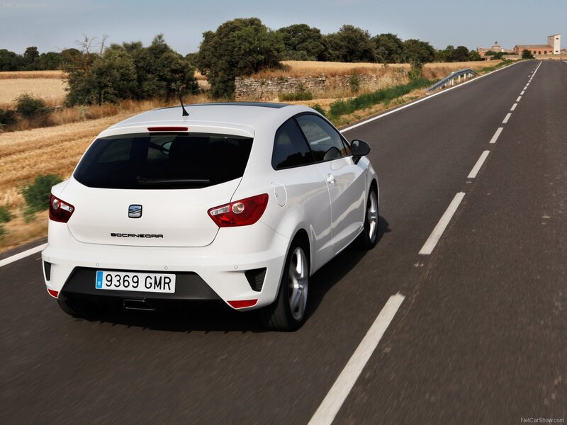 White SEAT Ibiza driving on road