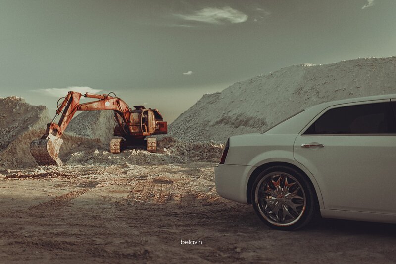 White Sedan and Excavator