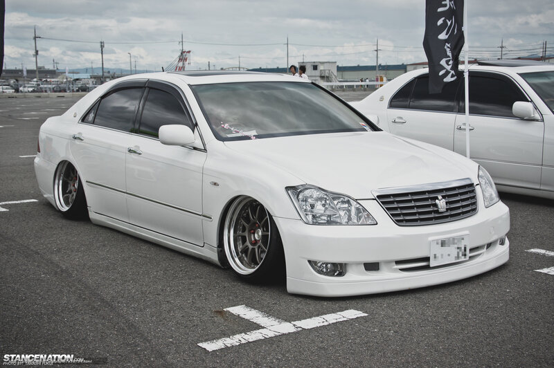White sedan at car show