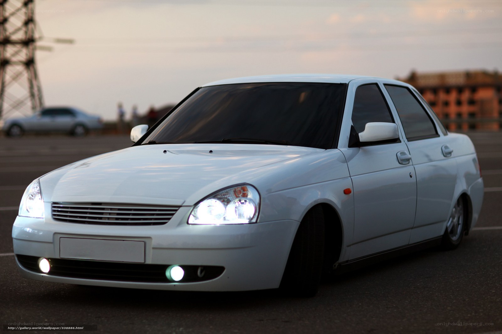 white sedan at dusk