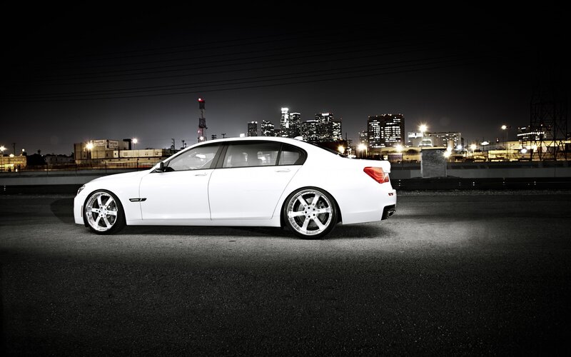 white sedan at night in city