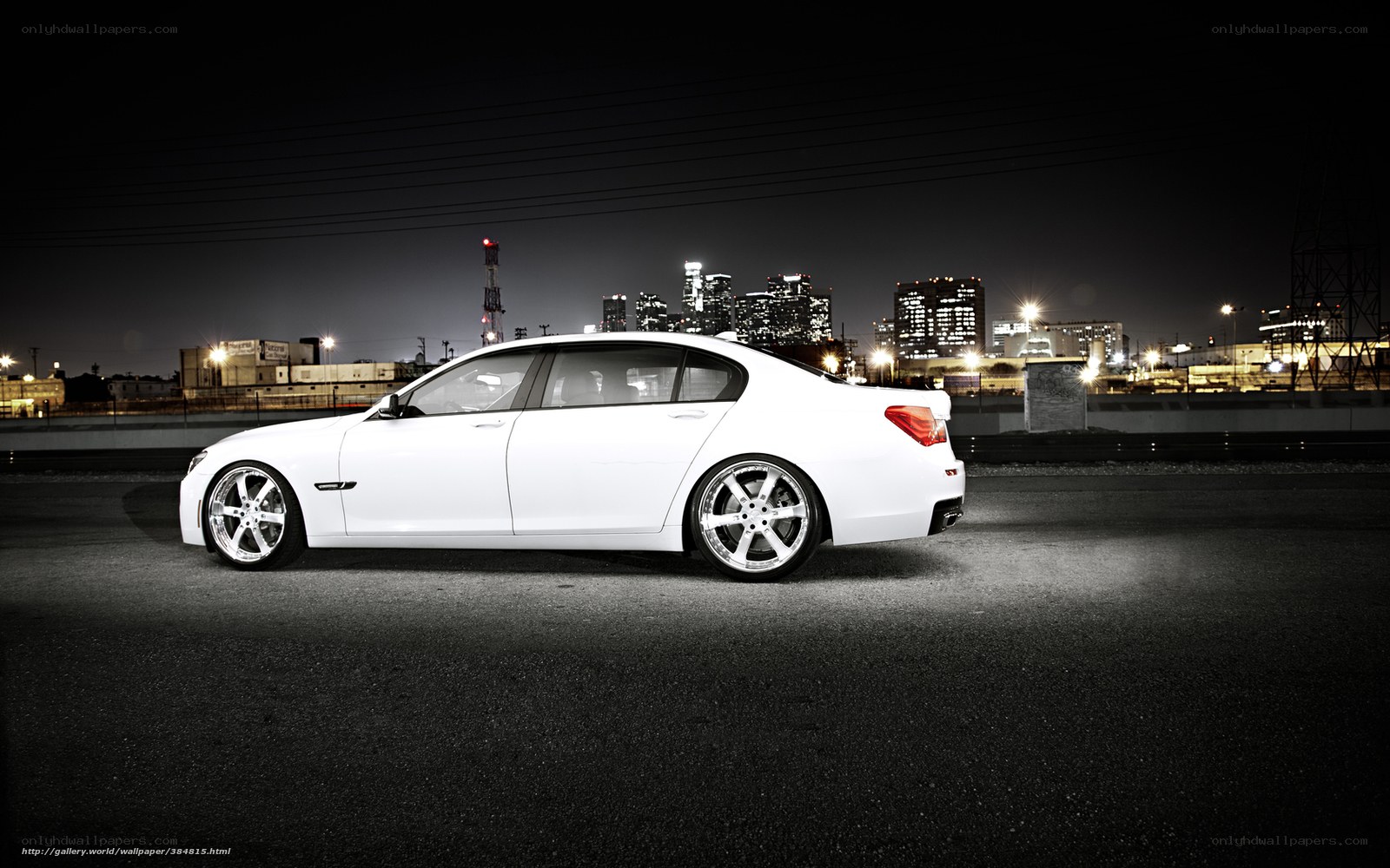 White sedan at night in city