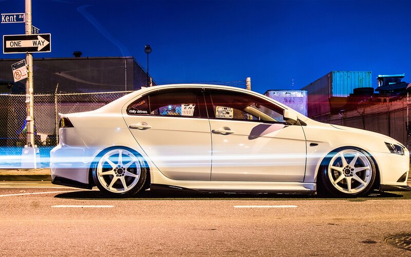 white sedan at night on street