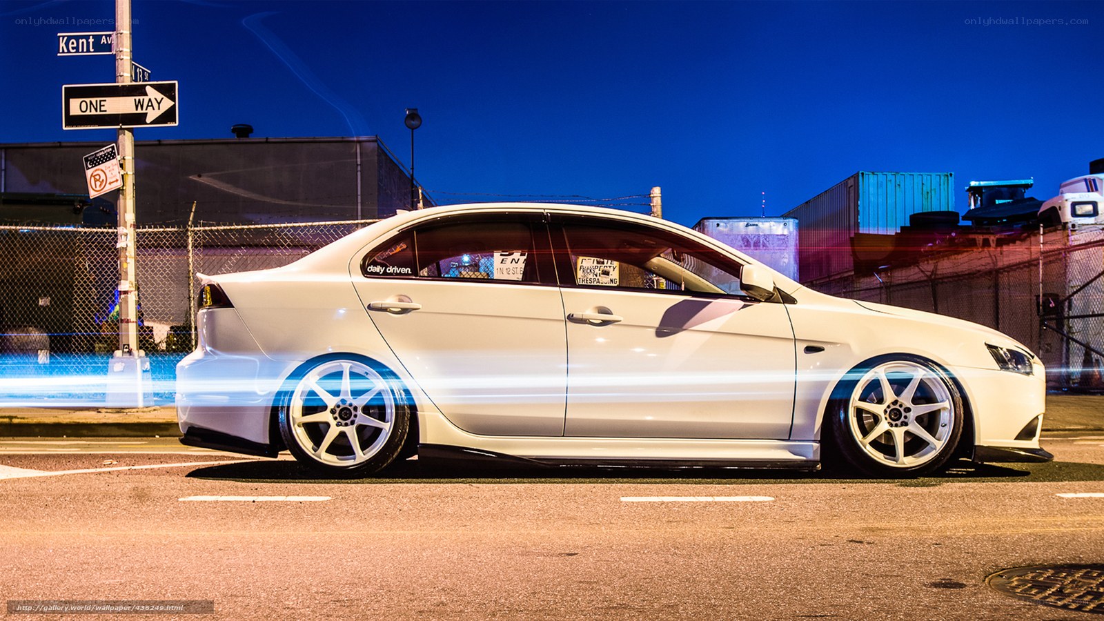 white sedan at night on street