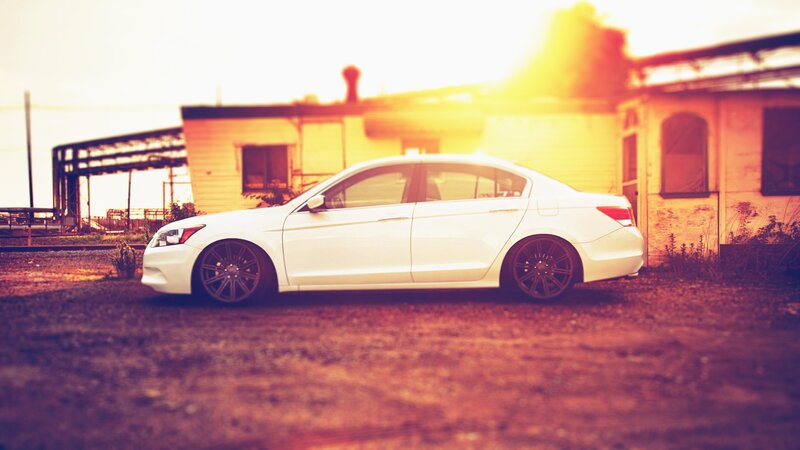 white sedan at sunset