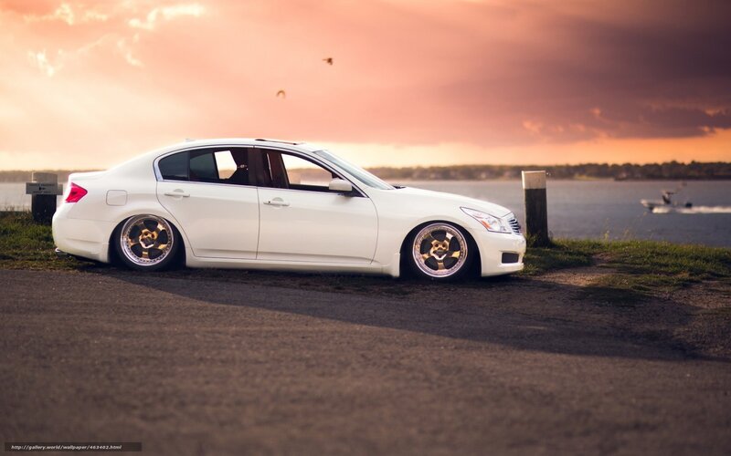 white sedan at sunset