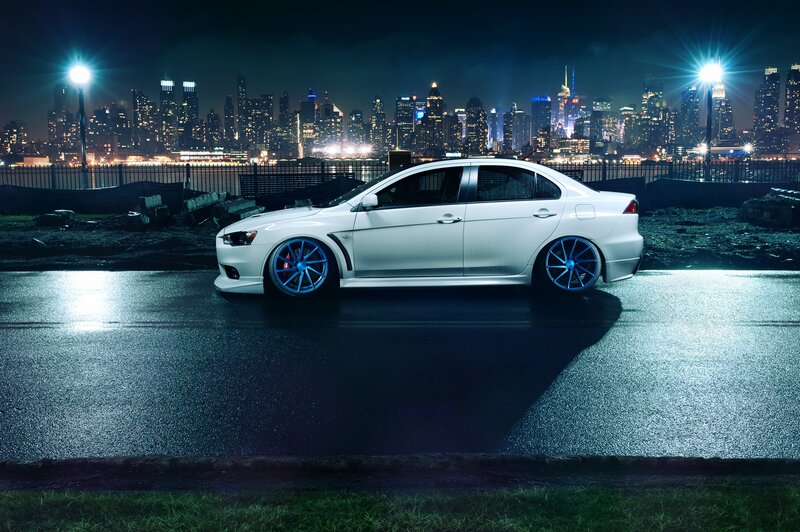 White Sedan Car — Dramatic, Night, Photograph, City Skyline, Streetlights