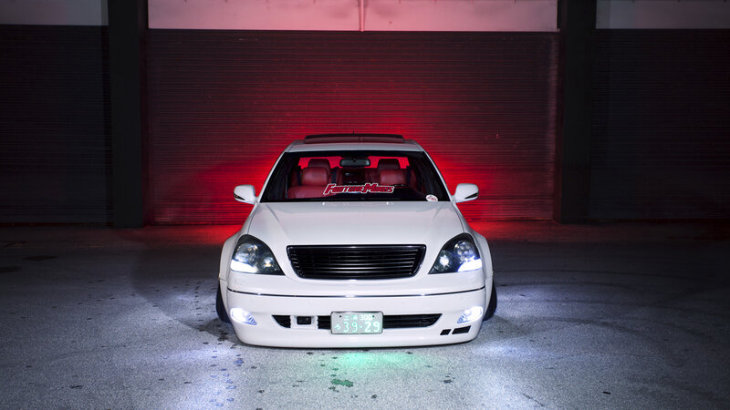 White Sedan Car — Dramatic, Night, Photograph, Garage Door