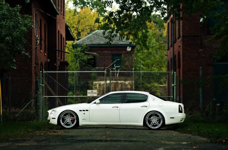 white sedan in alleyway