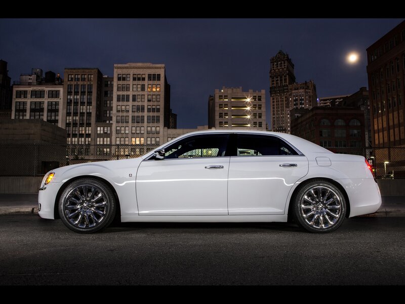 White sedan in city at night