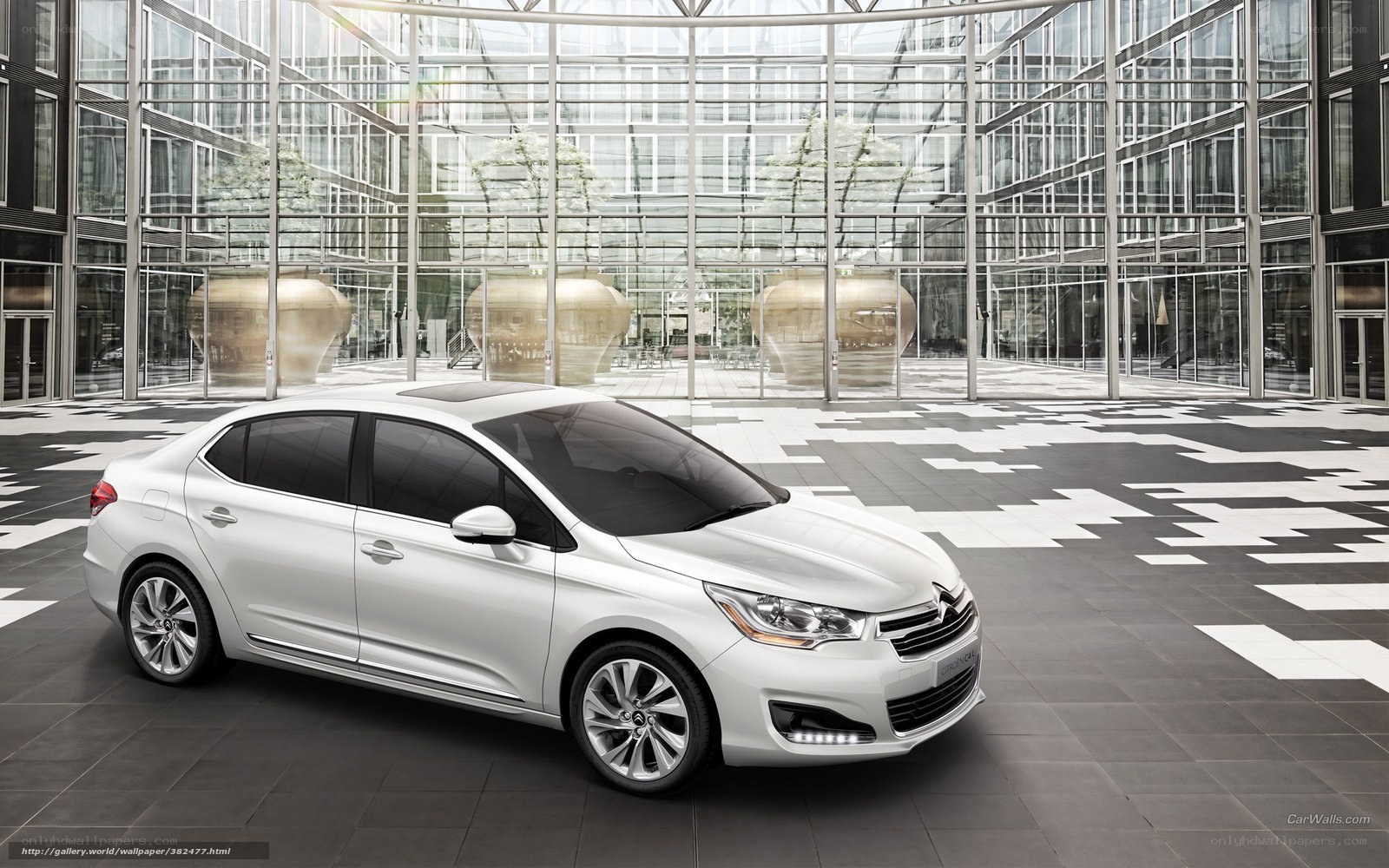 White sedan in modern atrium