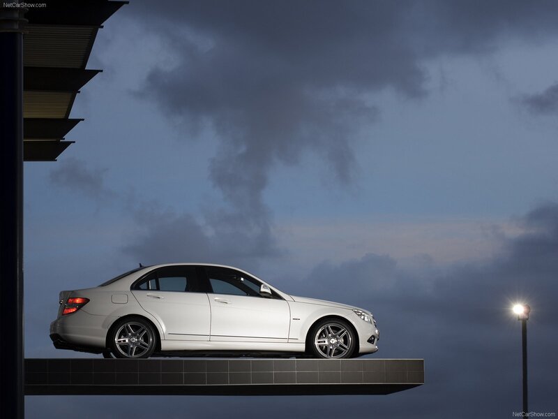 White sedan on a platform