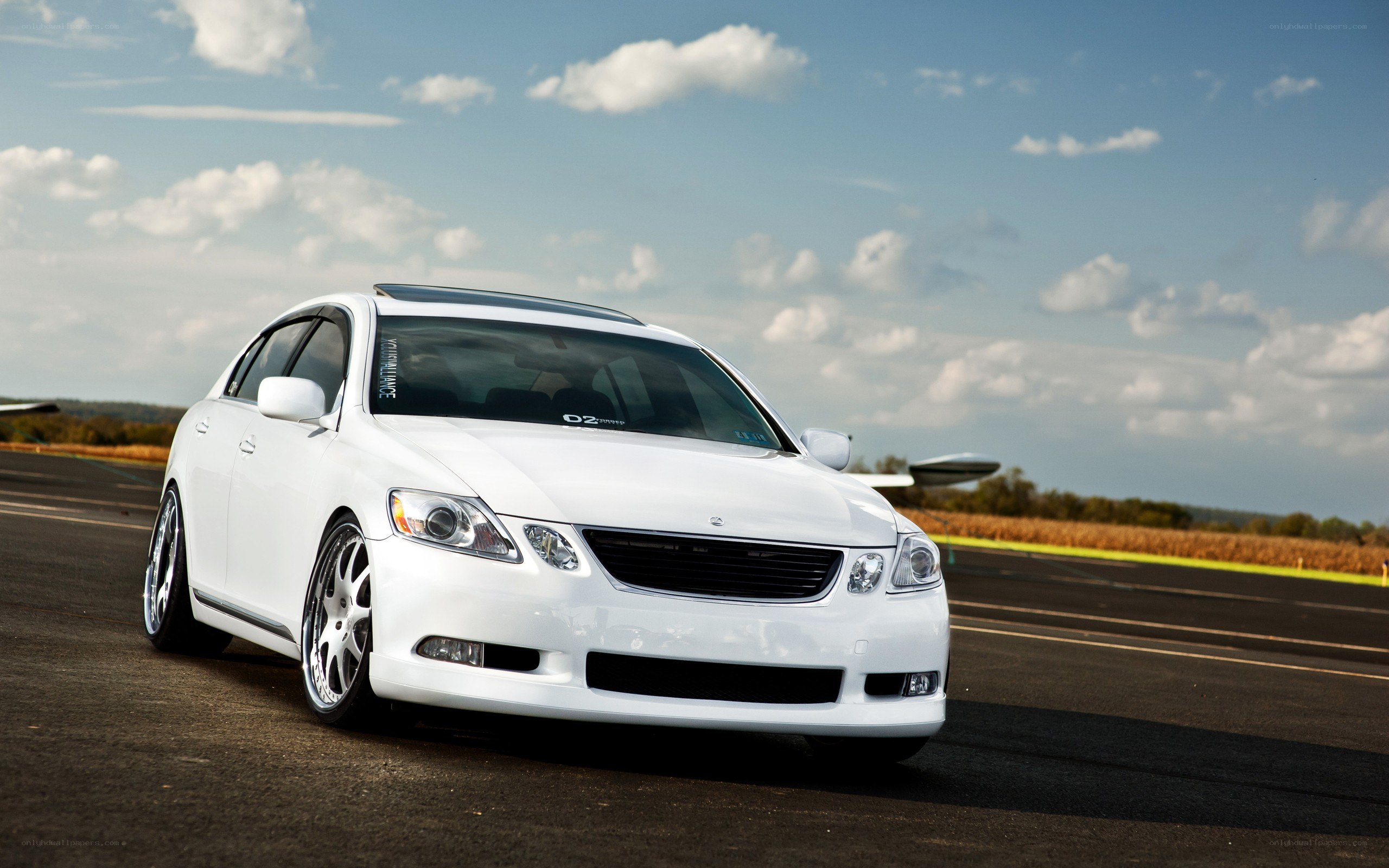white sedan on a track