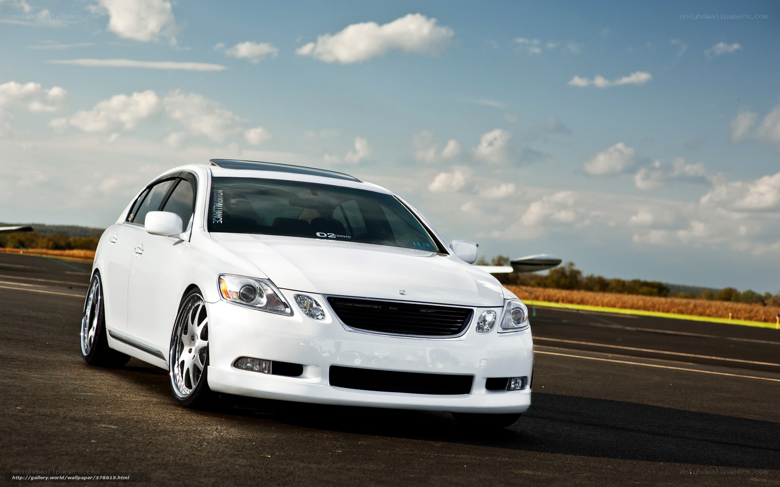 white sedan on airstrip