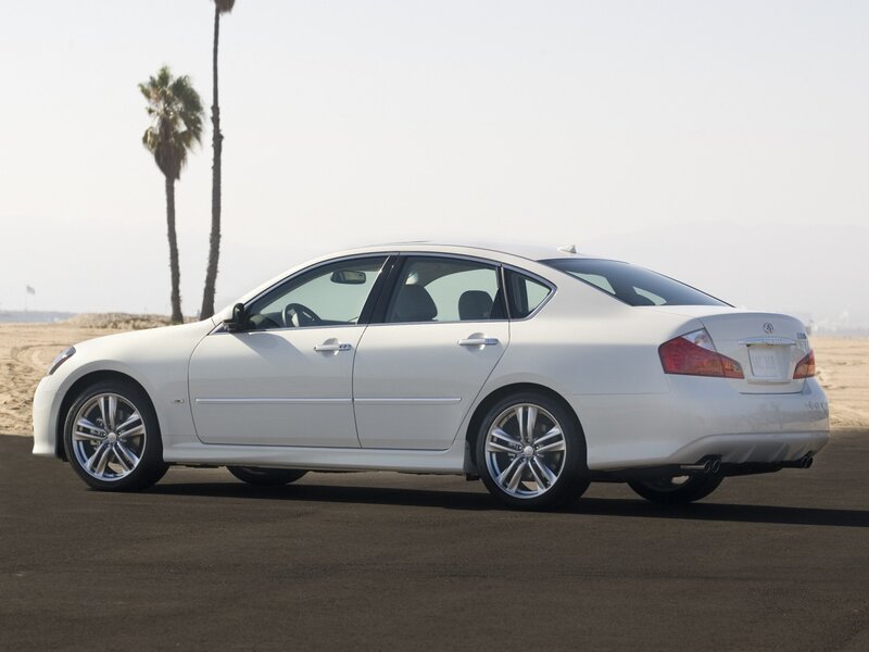 White sedan on beach