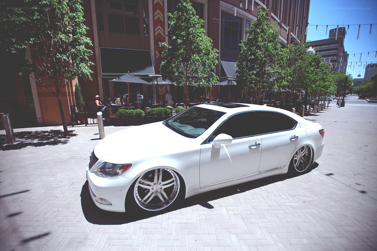 white sedan on city street