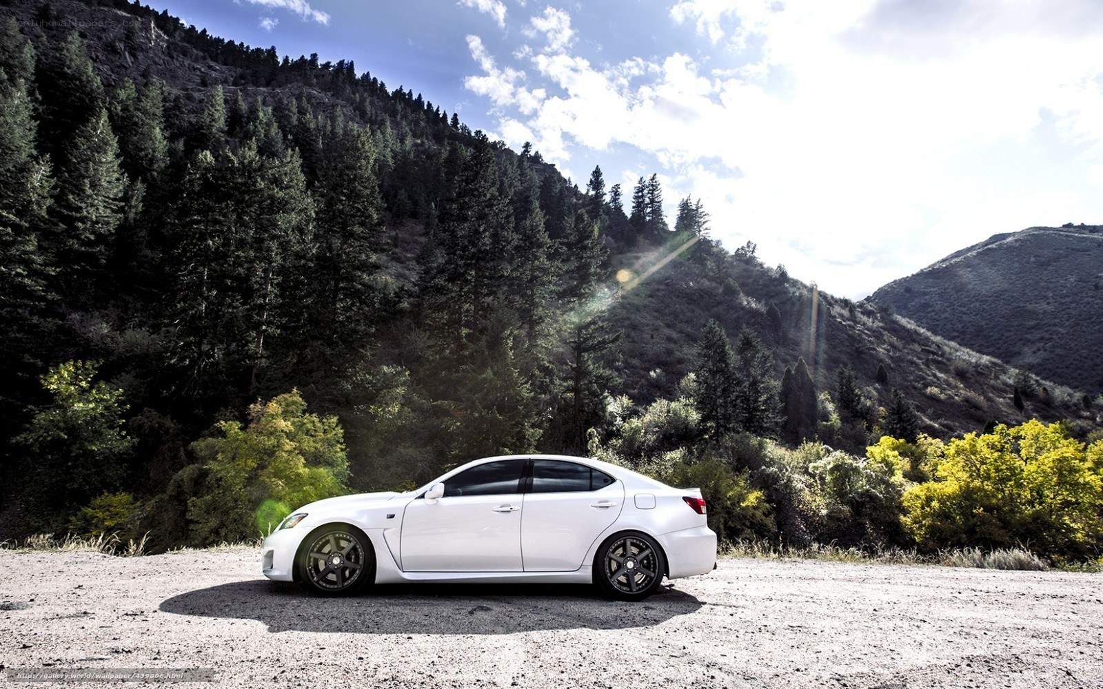 White sedan on mountain road