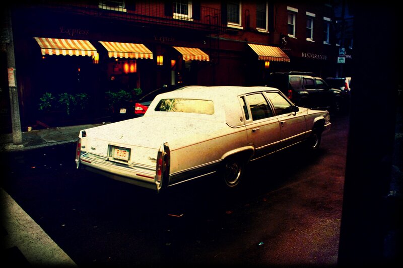 White Sedan on Street — Black