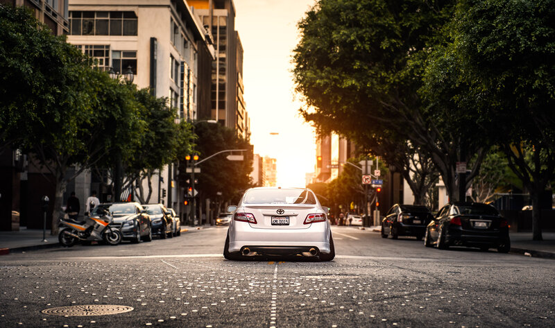 White Sedan on Street — Gray