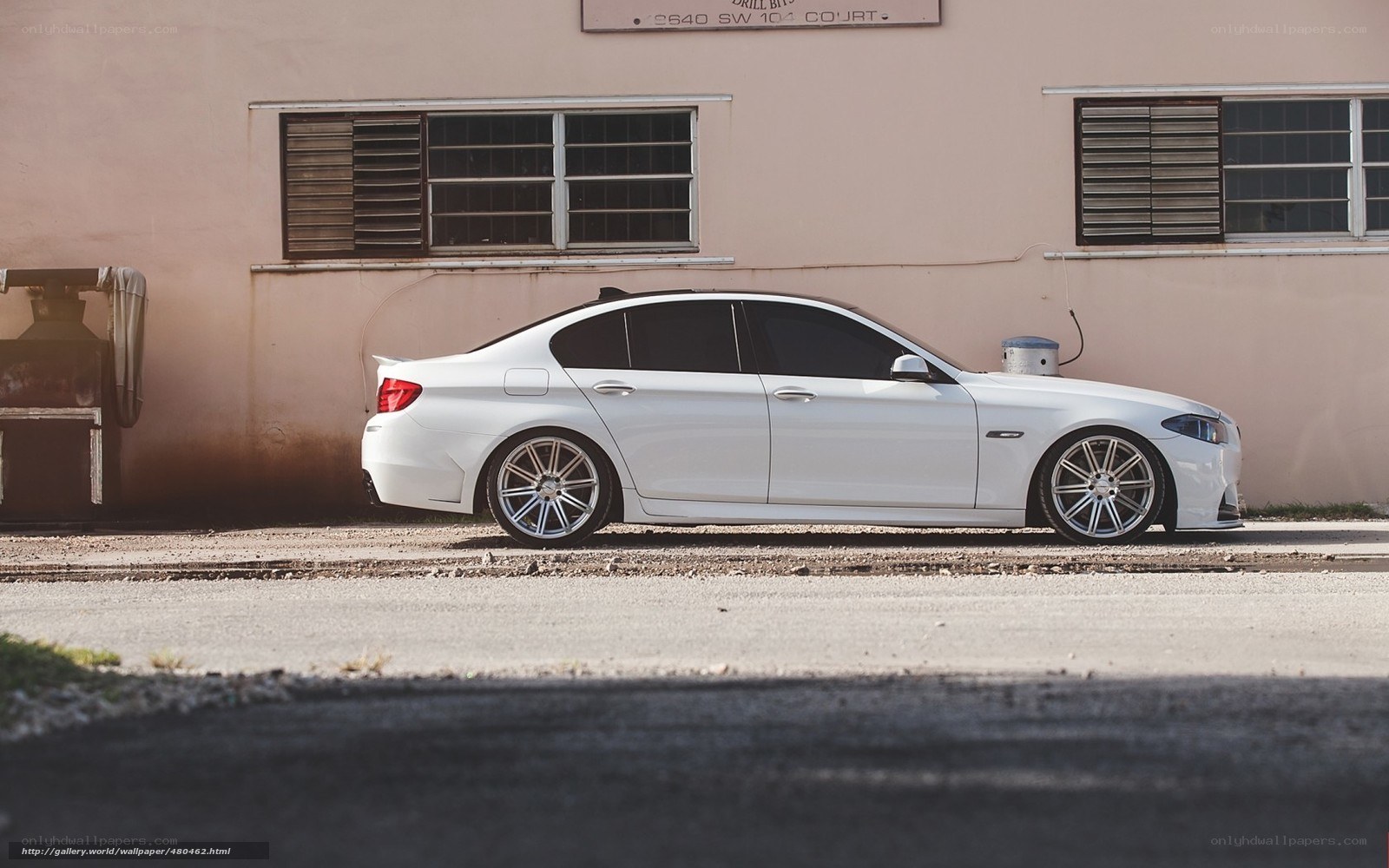 white sedan parked on street