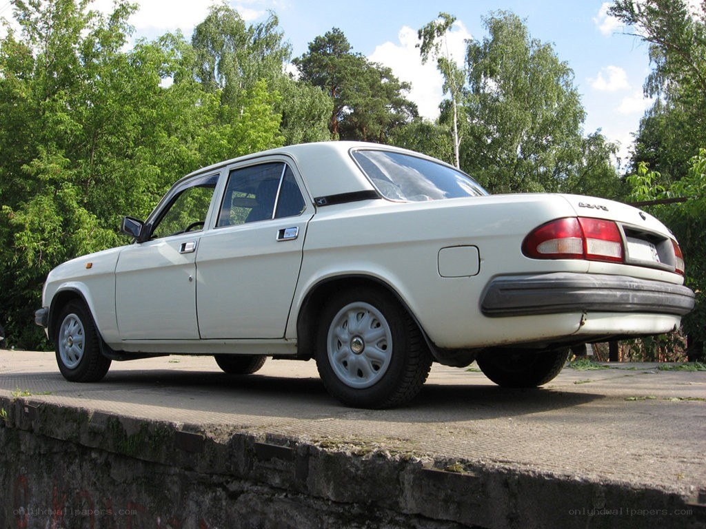 white sedan parked outdoors