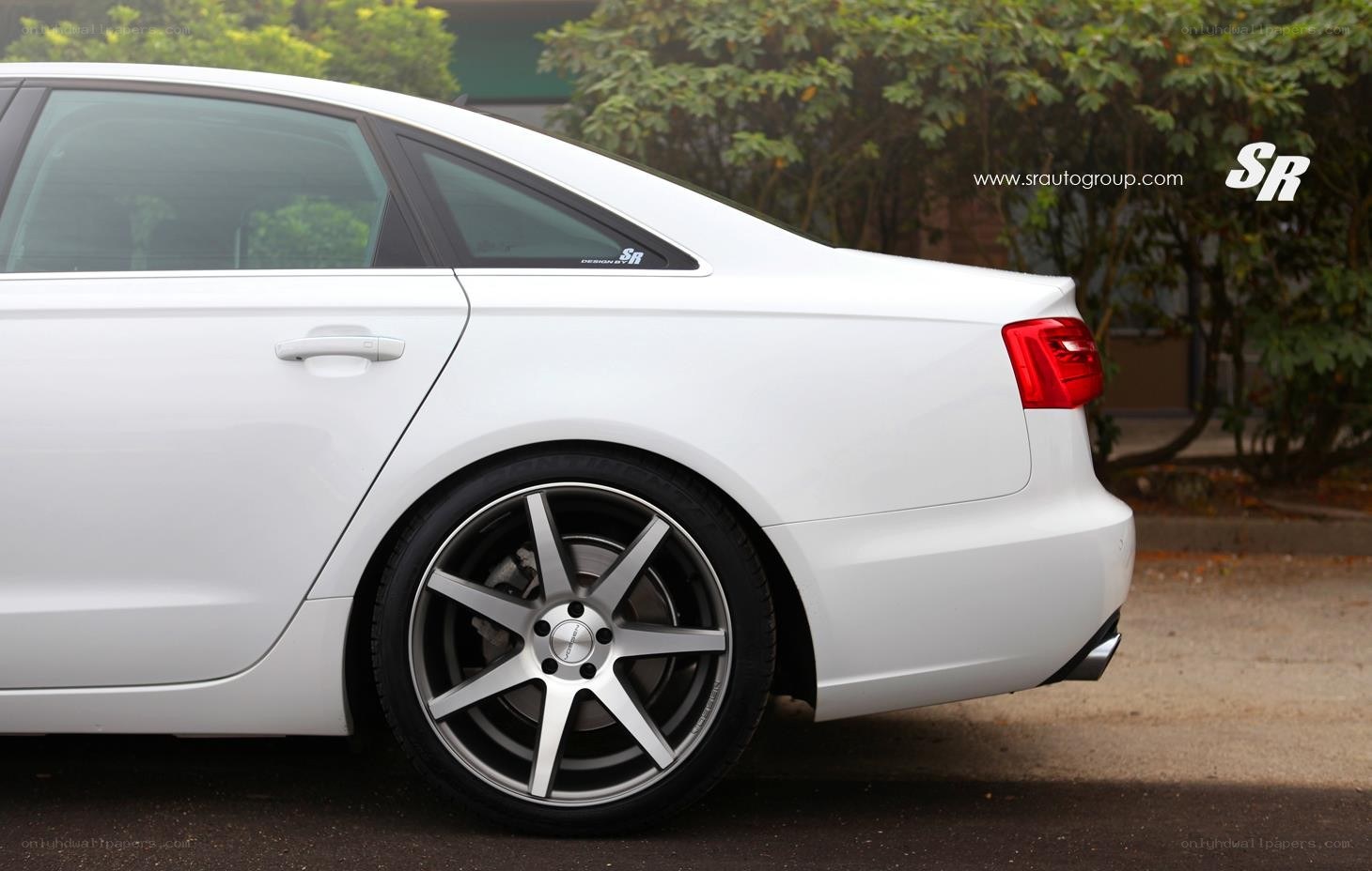 white sedan with custom wheels
