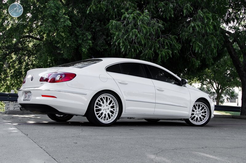white sedan with custom wheels