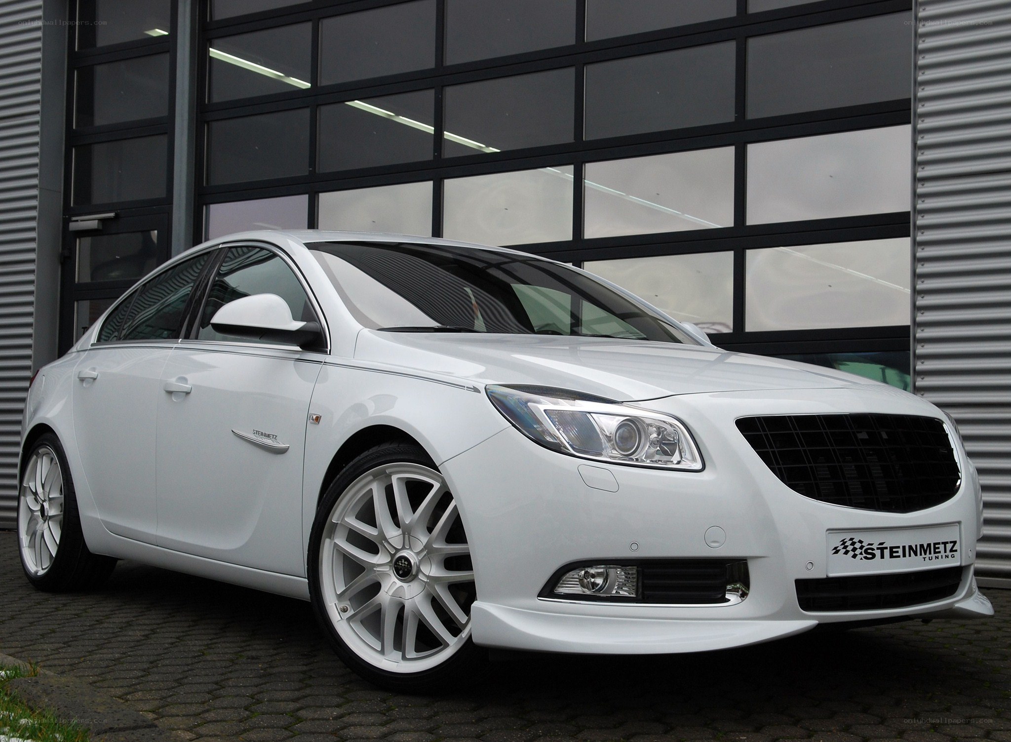 white sedan with custom wheels