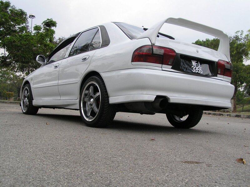 white sedan with rear spoiler