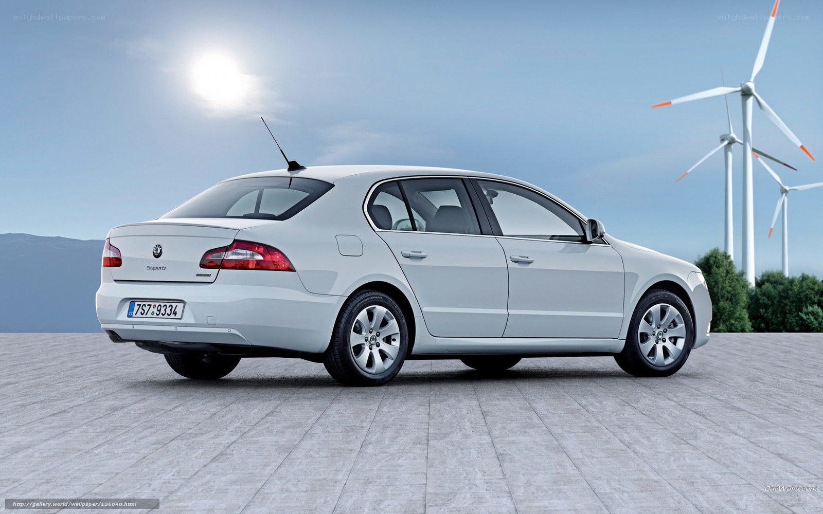 White sedan with wind turbines