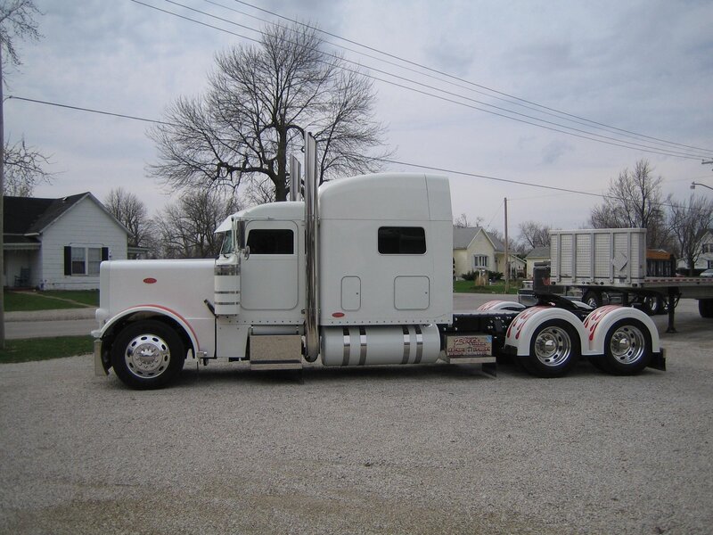 white semi-truck on gravel