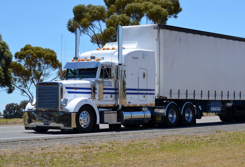 White Semi-truck on Road — Bright