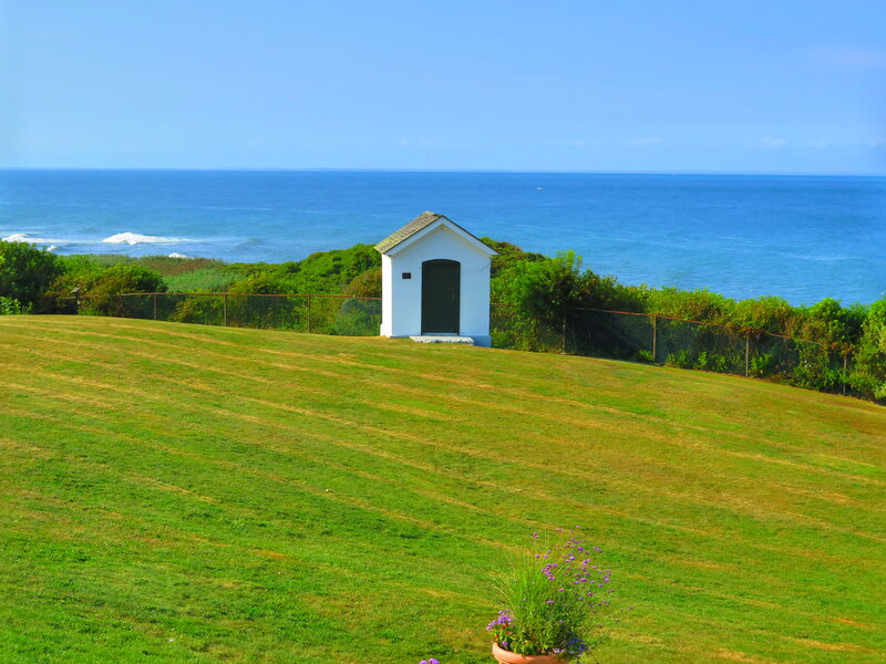 White Shed on Grassy Hill