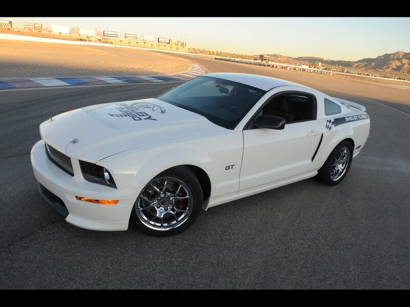 White Shelby GT on a racetrack