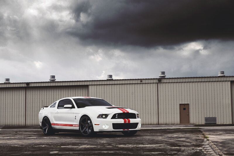 White Shelby GT500 — Dramatic, Photograph, Car, Building, Clouds