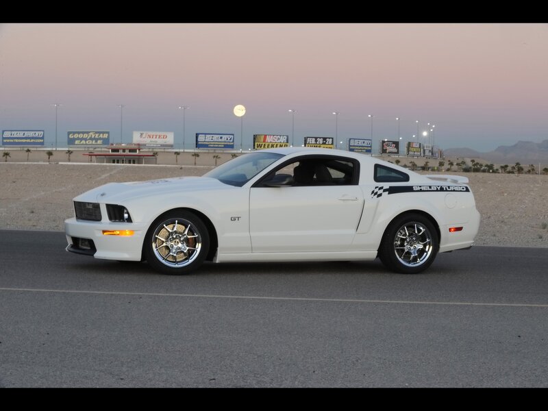 white shelby mustang on track