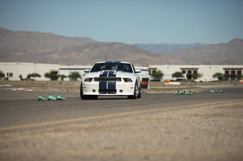 White Shelby Mustang on track