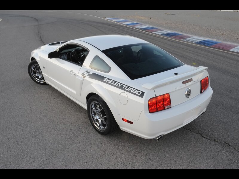 white shelby turbo on racetrack