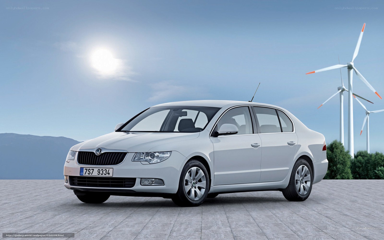 White Skoda Octavia with wind turbines
