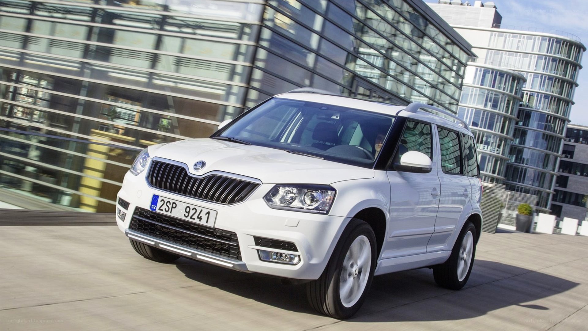 White Skoda SUV in city