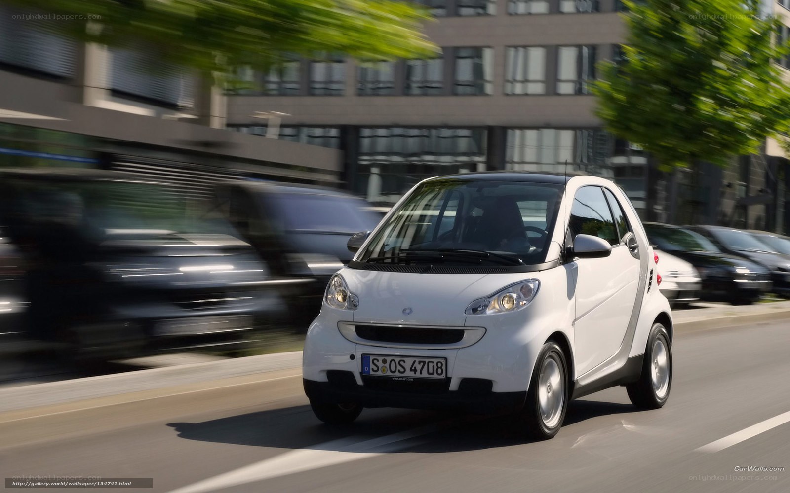 white smart car in motion