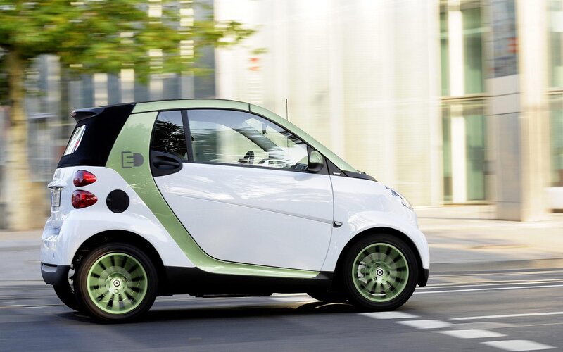 white smart car in motion