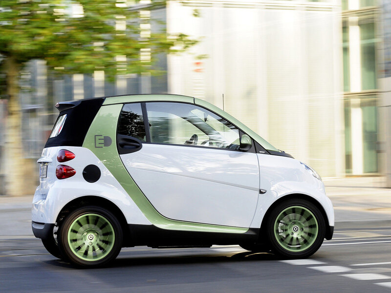 white smart car in motion