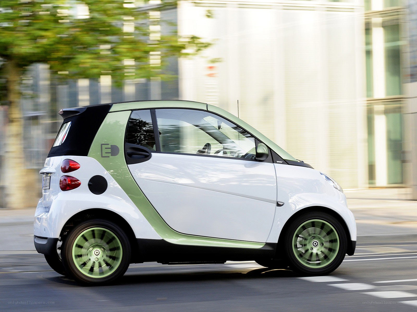 white smart car in motion
