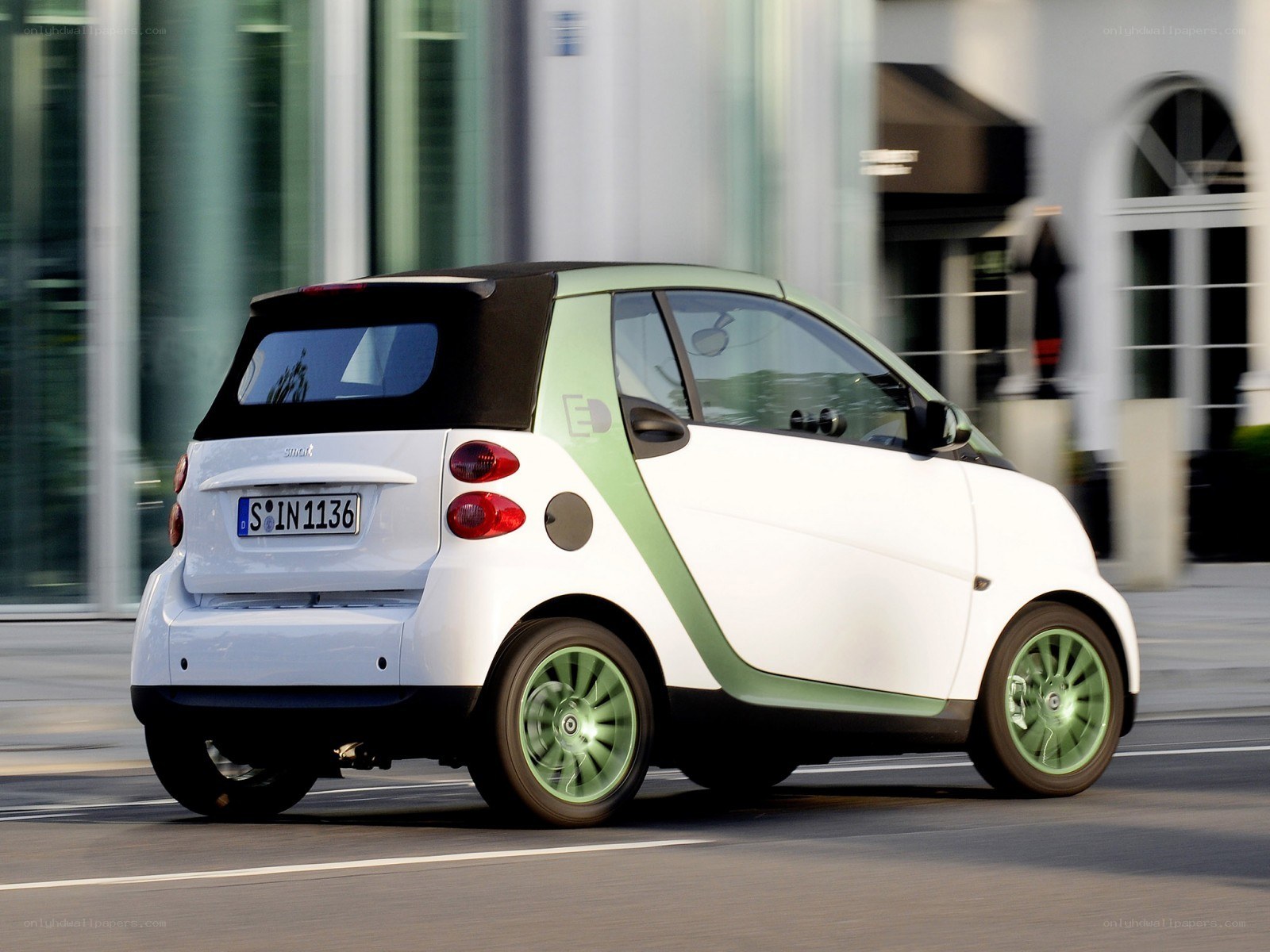 white smart car in motion
