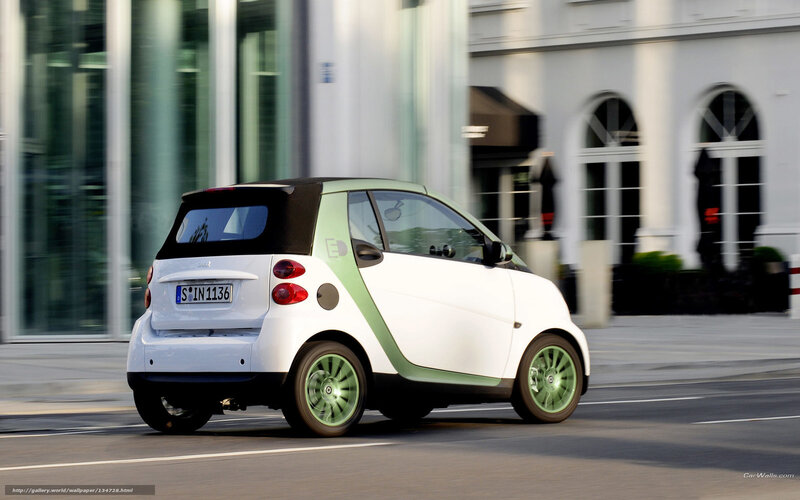 white smart car on city street