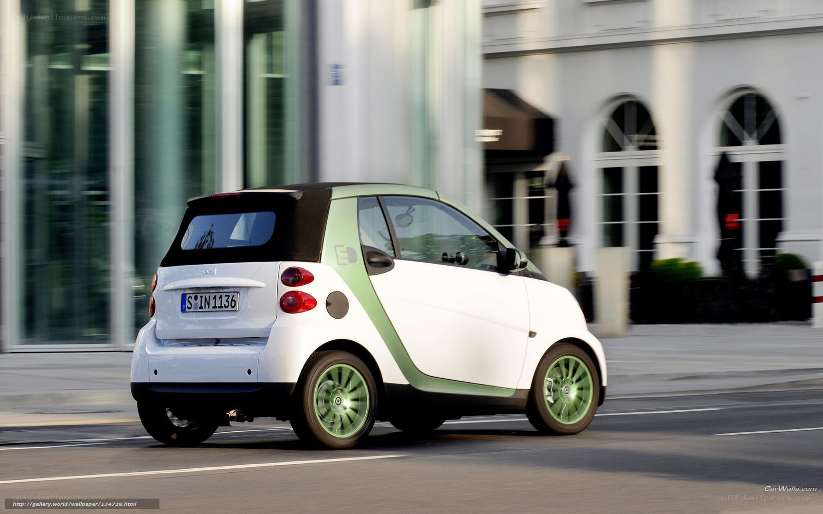 white smart car on city street