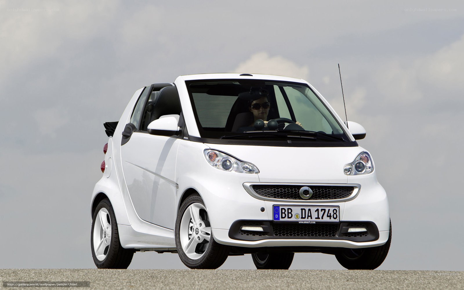 white smart car on road