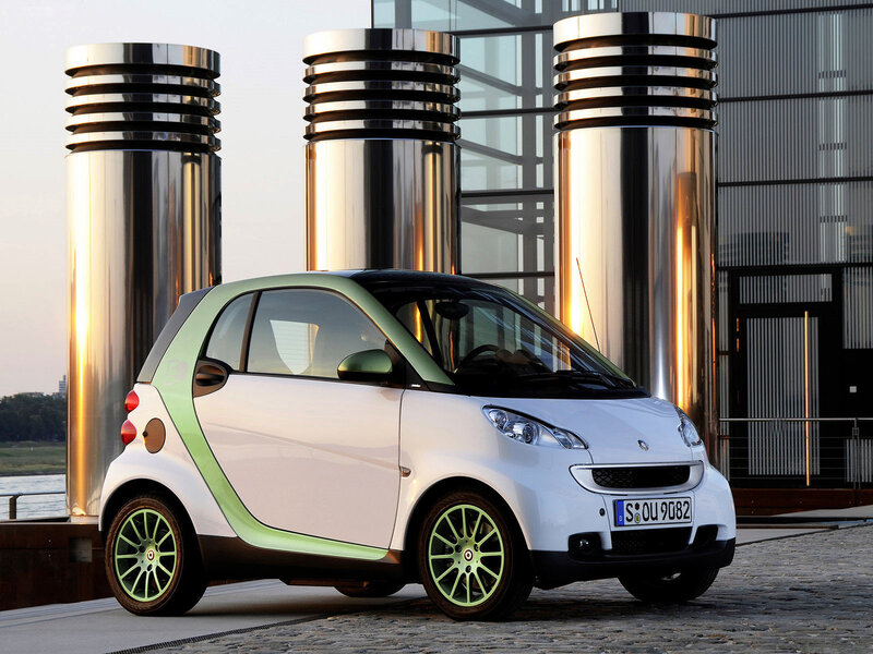 White smart car with green accents