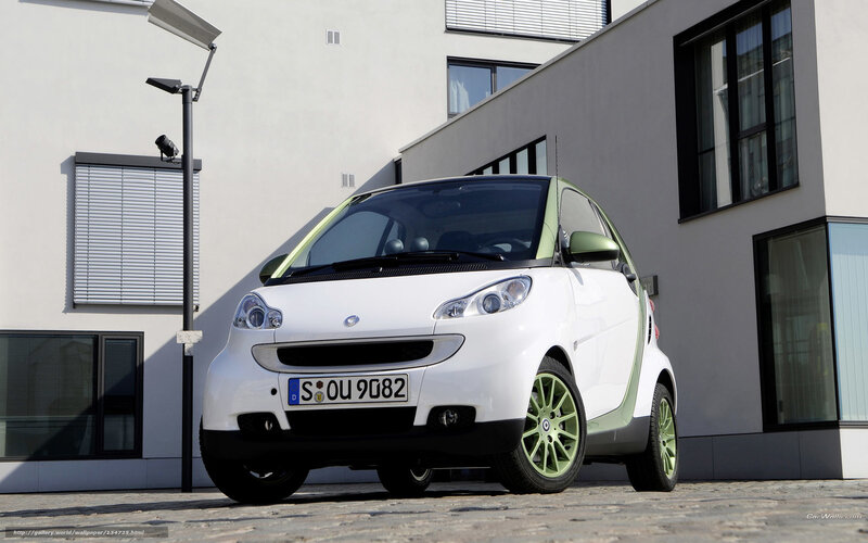 white smart car with green accents